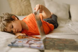 Kids read books. Little boy reading at home. Children home schooling. Stay home. Life at home